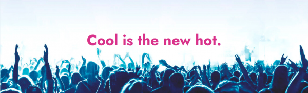 Crowd of people with raised hands at a concert or event under the text